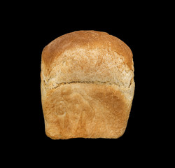 White bread loaf isolated on black background