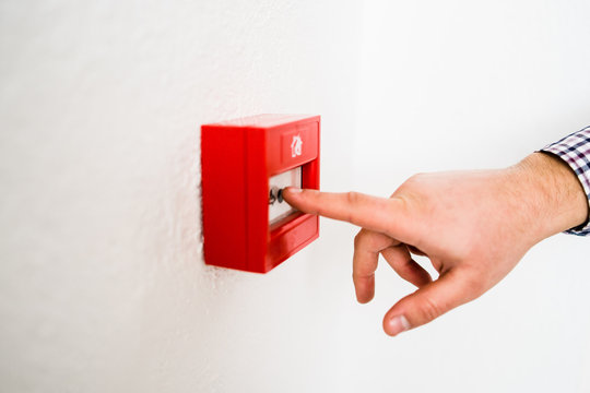 close up on hand activating the alarm