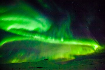 Aurora Borealis or better known as The Northern Lights for background view in Iceland, Snaefellsnesvegur during winter