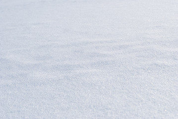 Obraz premium Snow cover. Snow surface in perspective. Shallow DOF