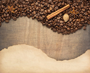 coffee beans and old paper on wood