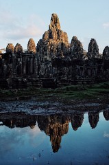 Fototapeta premium one of the most famous temple at sunset with golden light and reflection in the small pond pool of rain water