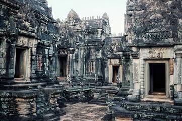 inner yard of one of the temple with carved stone doors and walls so typical for the khmer culture
