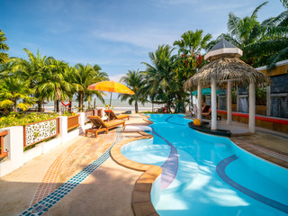 Swimming pool in luxury resort or hotel near beach, Thailand