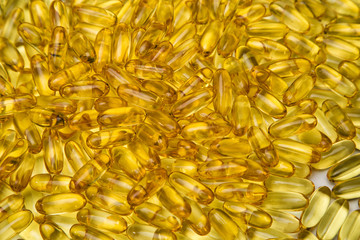 Background of yellow fish oil in pills