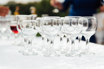 Many empty champagne glasses on the table