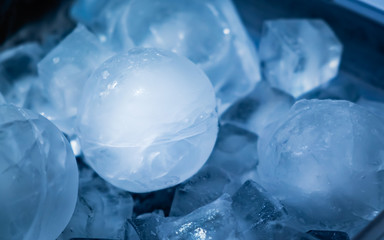 Ice sphere with ice cube background