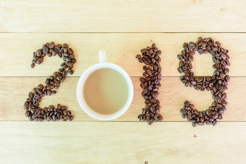 hot cappuccino coffee with 2019 text / Happy New year 2019