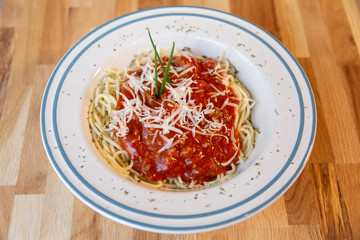 Spaghetti bolognese with tomato sauce, meat and cheese