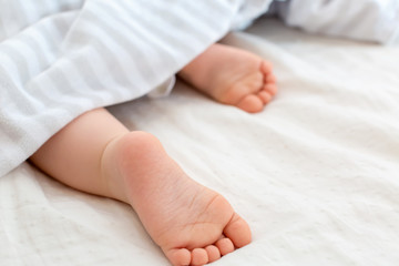 The feet of a young baby boy - no face