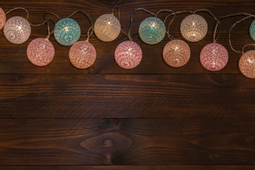 Christmas lights on a wooden table