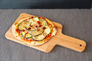 Aerial view of a pizza with vegetable with gratin mozzarella cheese