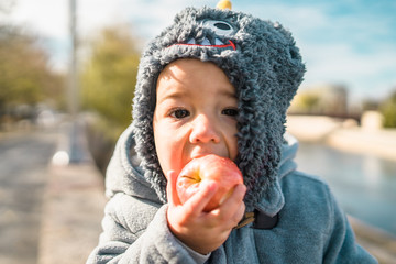 Baby Boy Eating an apple