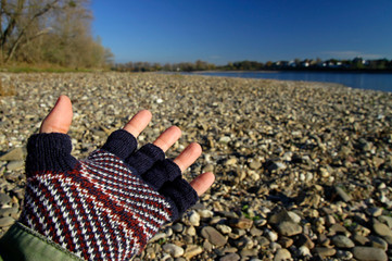 Man reaching out with hand during winter time