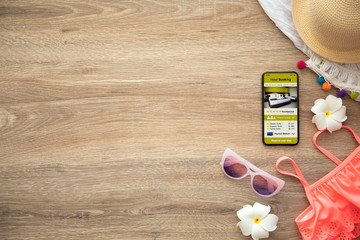 phone with app hotel booking on screen things for holidays