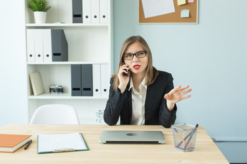 Business, realtor and people concept - Attractive woman in office talking on phone.