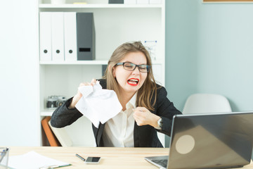 Stress, office, hysteric, people concept - aggressive woman with a lot of work in office