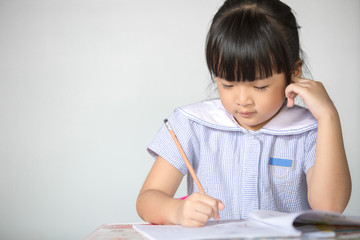Little asian doing homework