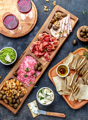 Antipasto Platter. Ham serrano, salami olive jamon dip sauces and red wine