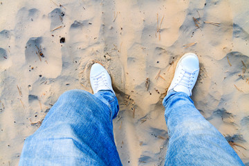 walk in the sand dunes in white shoes