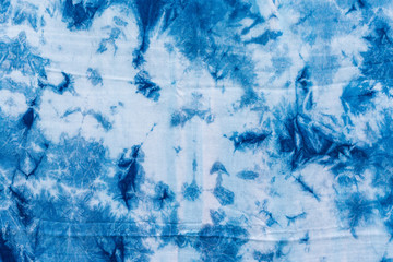 The fabric indigo tie dye as a background and texture.
