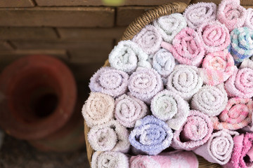 Pile of cloth, hand towel in wooden basket