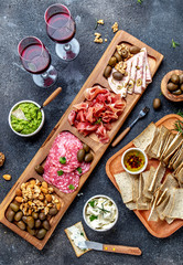 Antipasto Platter. Ham serrano, salami olive jamon dip sauces and red wine