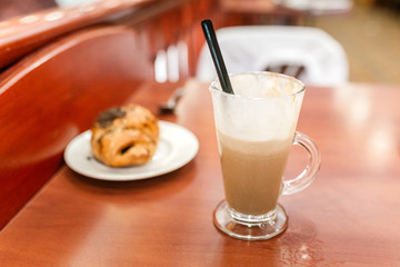 Coffee with croissants on the table in cafe
