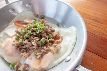 Traditional Thai breakfast- Hot Pan Eggs Recipe - Breakfast Thai Style on  wooden table