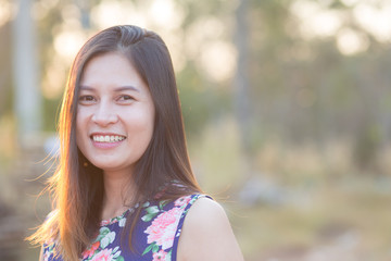 Naklejka premium portrait of young cheerful asian woman,