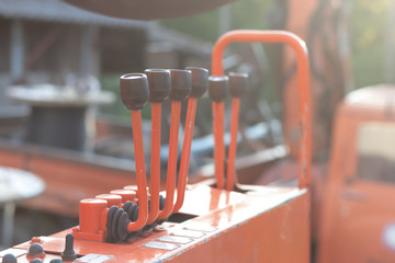 Old crane truck hydraulic control,hydraulic for controlling the functions of the truck equipment. © warongdech