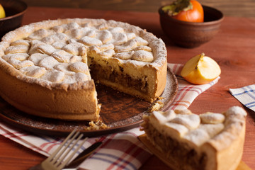 Homemade apple pie on a wooden table.