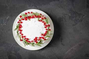 cake with pomegranate and rosemary (chocolate cake). top view.