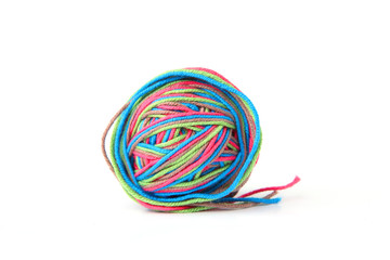 Colorful cotton thread ball from four color thread isolated on white background. Different color pink, green, grey, blue thread mix.