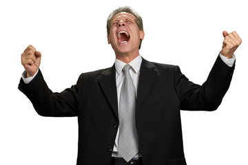 Ecstatic executive celebrating victory. Successful businessman raised hands and opened mouth in excitement, isolated on white background.