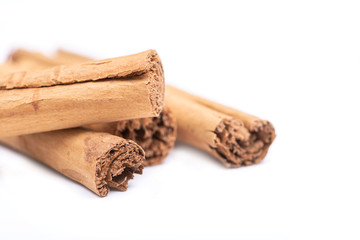 Cinnamon sticks tied with jute rope isolated on white background