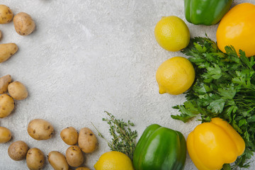set of fresh vegetables on grey background top view place on text