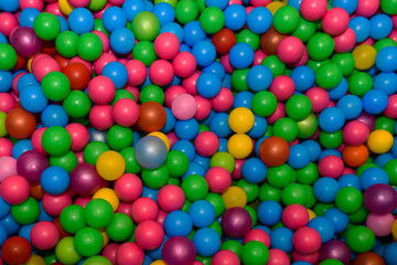 A lot of plastic colored balls. Toy children's different sphere. 