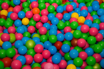 A lot of plastic colored balls. Toy children's different sphere. 