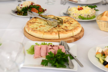 Cold dishes and snacks on the festive table. A rich luxurious meal in the restaurant. 