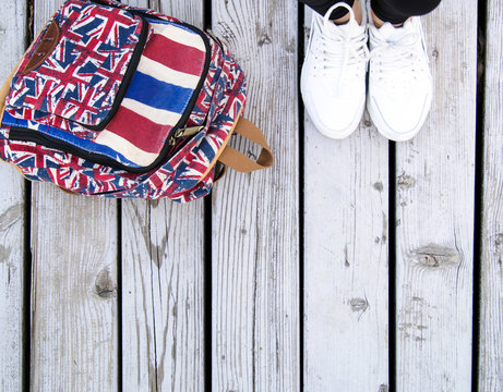 Women's white sneakers and backpack