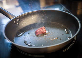 Fried piece of meat in a pan