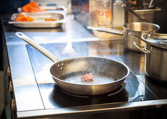 Fried piece of meat in a pan