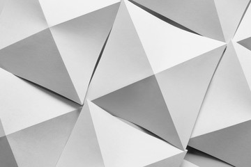 Abstract composition with white paper folded in geometric shapes 