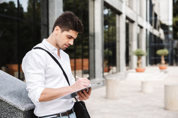 Confident successful young businessman