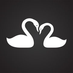 Pair of swans in love on black background icon
