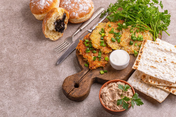 Tasty Hanukkah celebration food on vintage cutting board