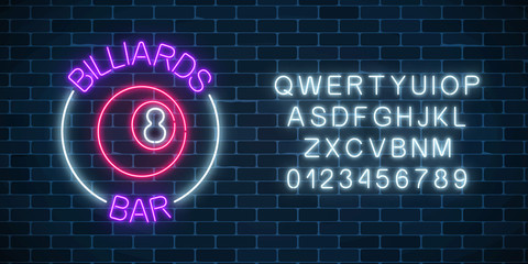 Neon billiards bar sign with alphabet on a brick wall background. Glowing billiard ball with 8 number.