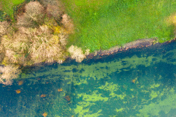     Croatian nature landscape, Dobra river from air, top down view from drone, Karlovac county, green surface of clear water in autumn 