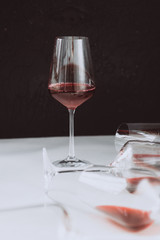 Glasses of red  wine  on white and dark background,  copy space.  Wine degustation concept